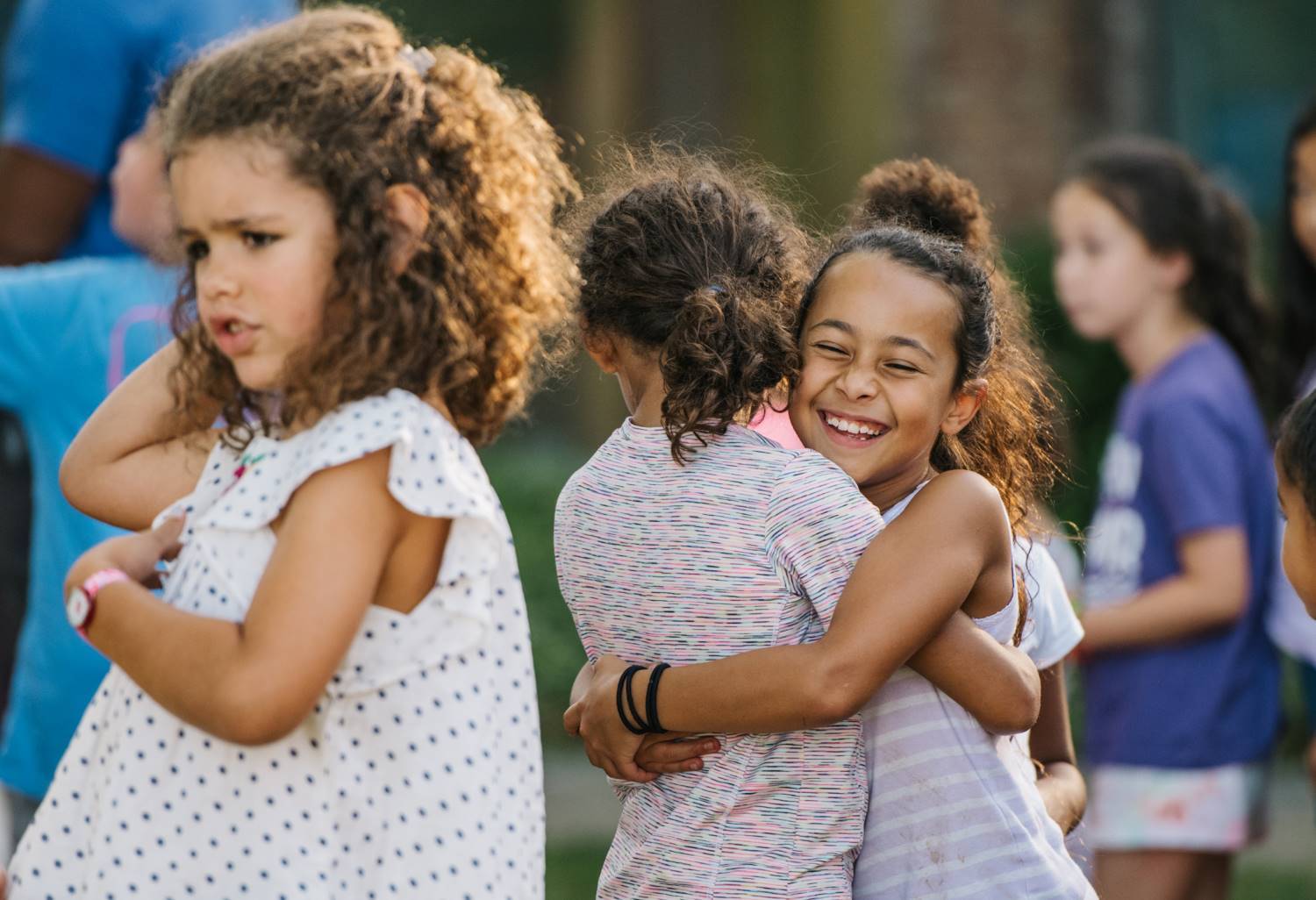 Two young girls hugging