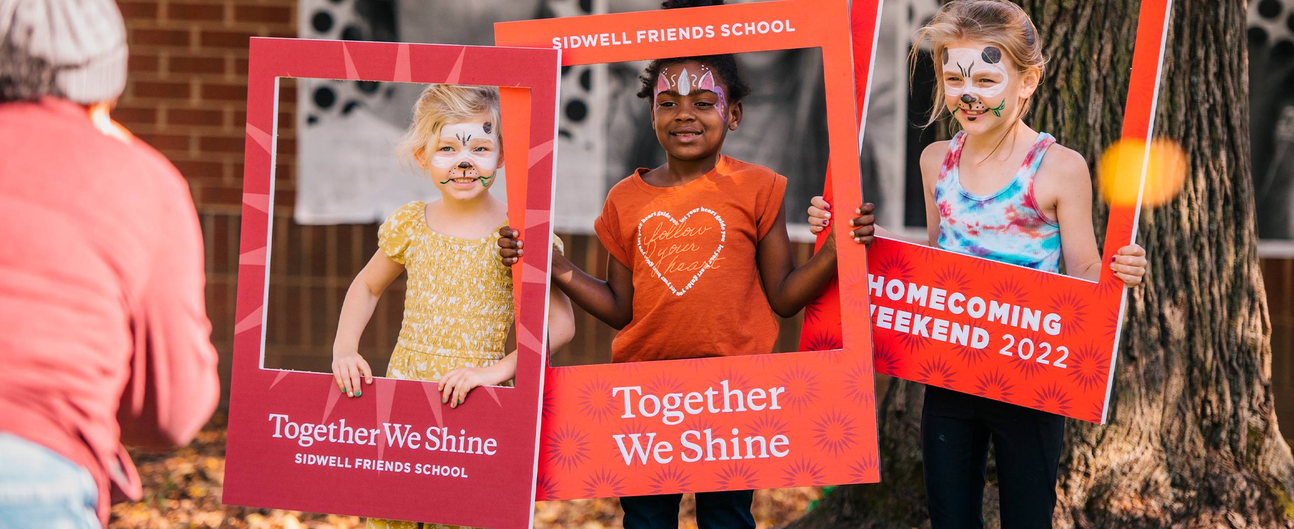 Together We Shine 3 Girls holding signs